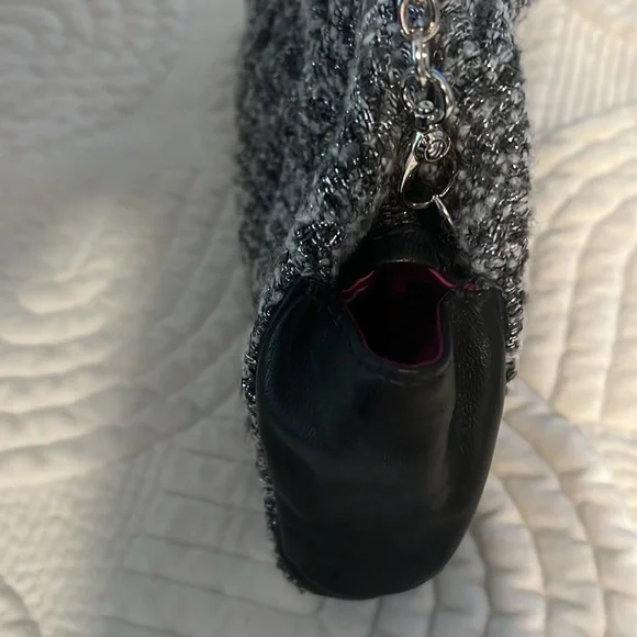 Shades of woven gray, and silver and black leather trim.Removable silver chain